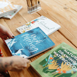 Lifestyle image of art books on a table